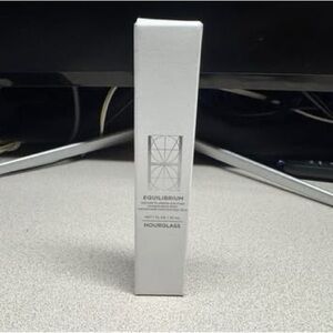 Hourglass Equilibrium in Elegant White Packaging